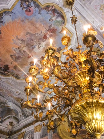 Two gilded wood and metal chandeliers, with floral motifs in the Ballroom